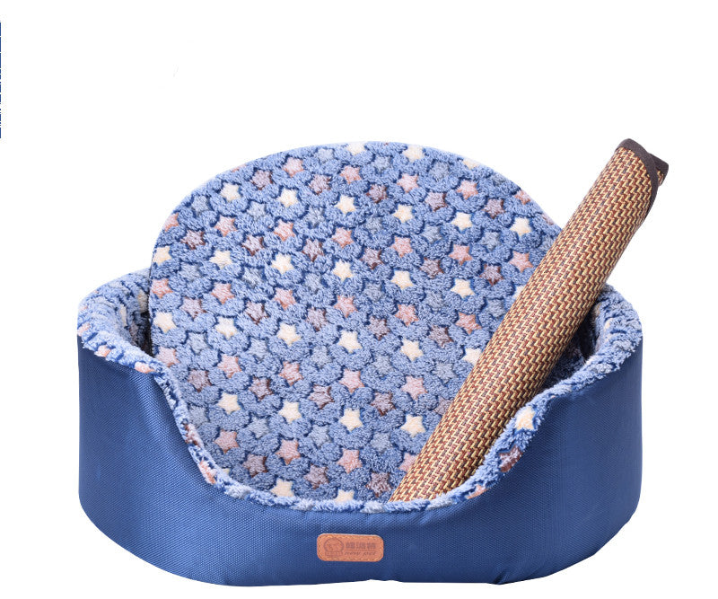 All-Season Dog Bed, oval blue fabric pet bed with raised sides, a soft star-patterned cushion and woven bolster