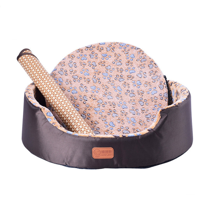 All-Season Dog Bed with dark gray oval sides, a pink patterned cushion and a rolled woven fabric bolster