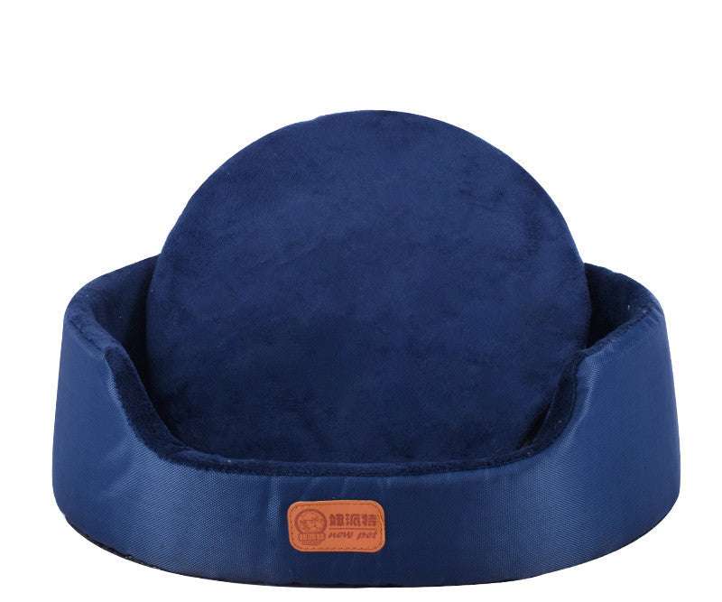All-Season Dog Bed in deep navy blue plush fabric, with raised padded sides and a round back cushion.