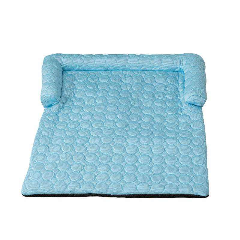 Bed Pet Cooling Mat in light blue quilted fabric with a cushioned raised bolster along three sides