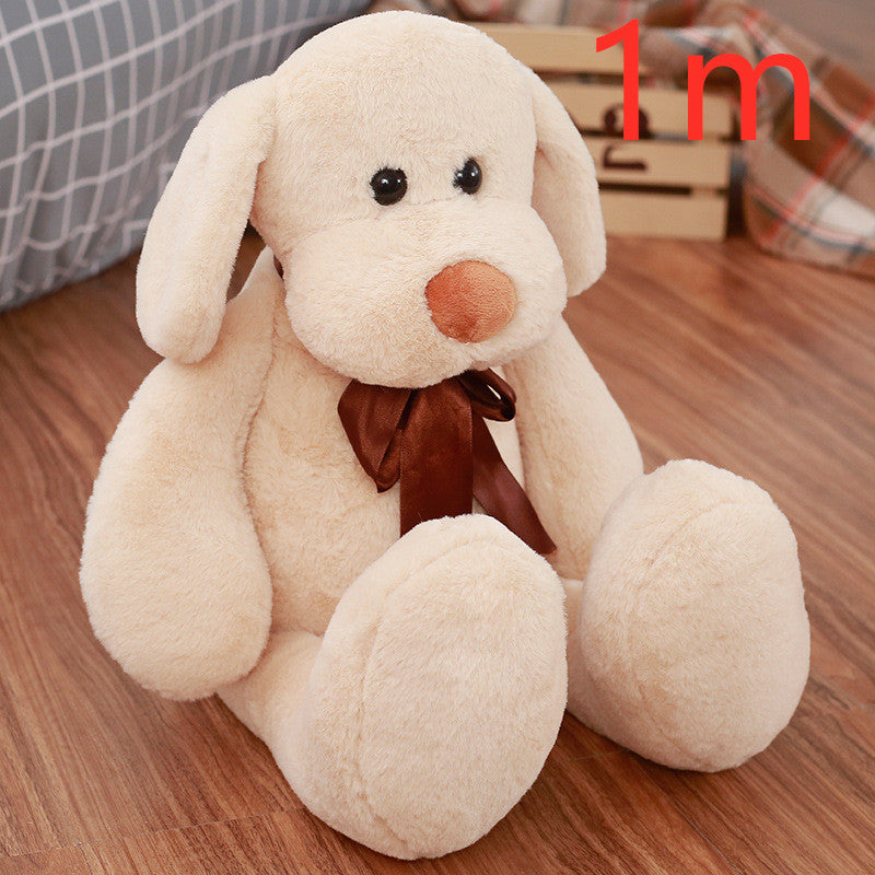 Cute Dull Dog Doll in cream short plush with floppy ears, round paws, a brown nose and satin bow