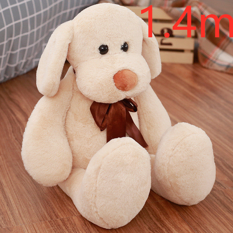 Cute Dull Dog Doll in cream short plush with floppy ears, a brown nose and a dark brown neck ribbon