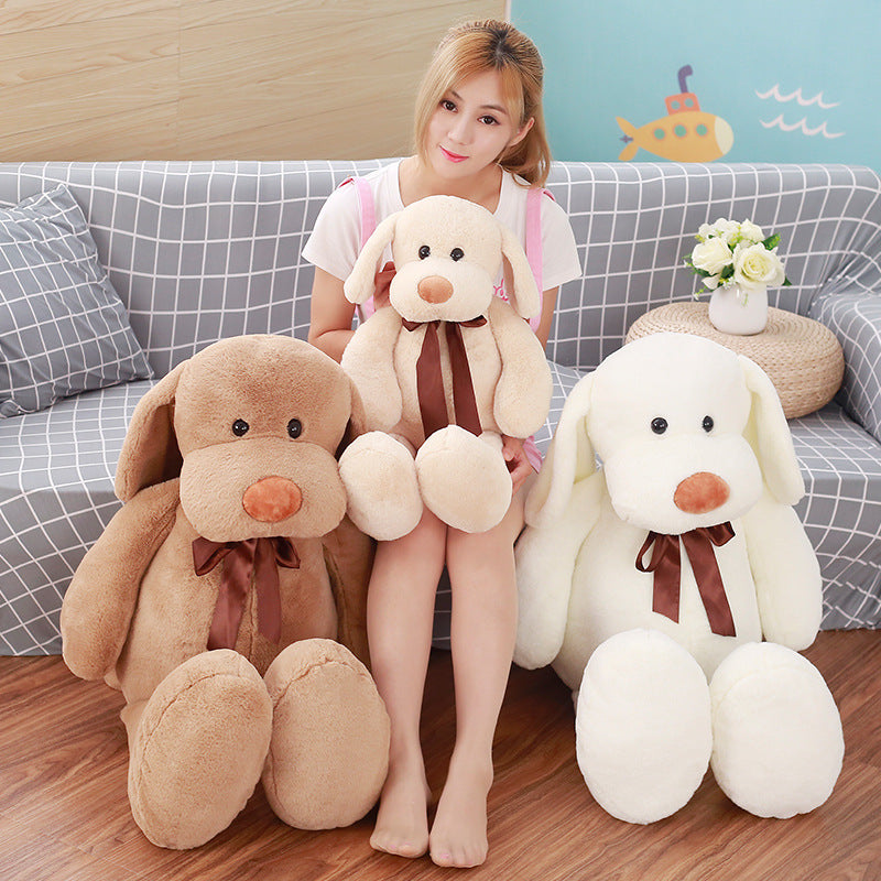 Cute Dull Dog Doll plush toy with soft short fur, long floppy ears, brown nose and ribbon, shown in brown, cream and white