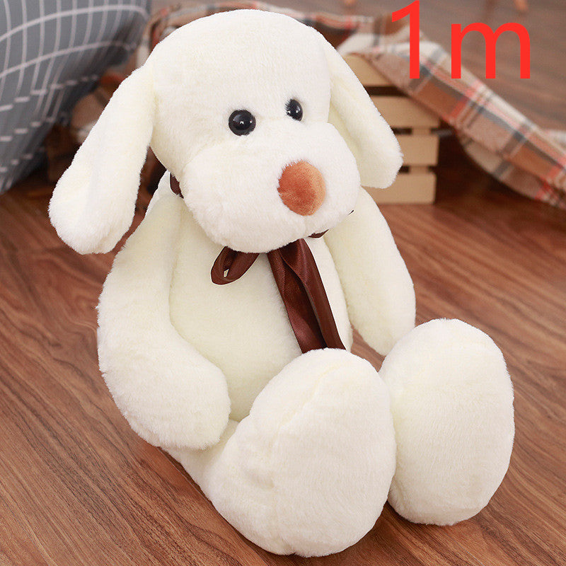Cute Dull Dog Doll plush toy in white short-pile fabric, with floppy ears, a brown nose and a dark brown ribbon