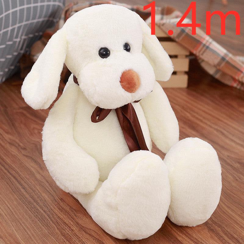 Cute Dull Dog Doll plush dog in creamy white short fur, with floppy ears, a brown nose and a ribbon tie