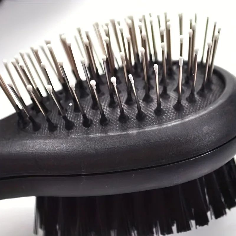 Double-Sided Pet Care Comb with a black plastic body, metal-tipped bristles on one side and dense black bristles beneath