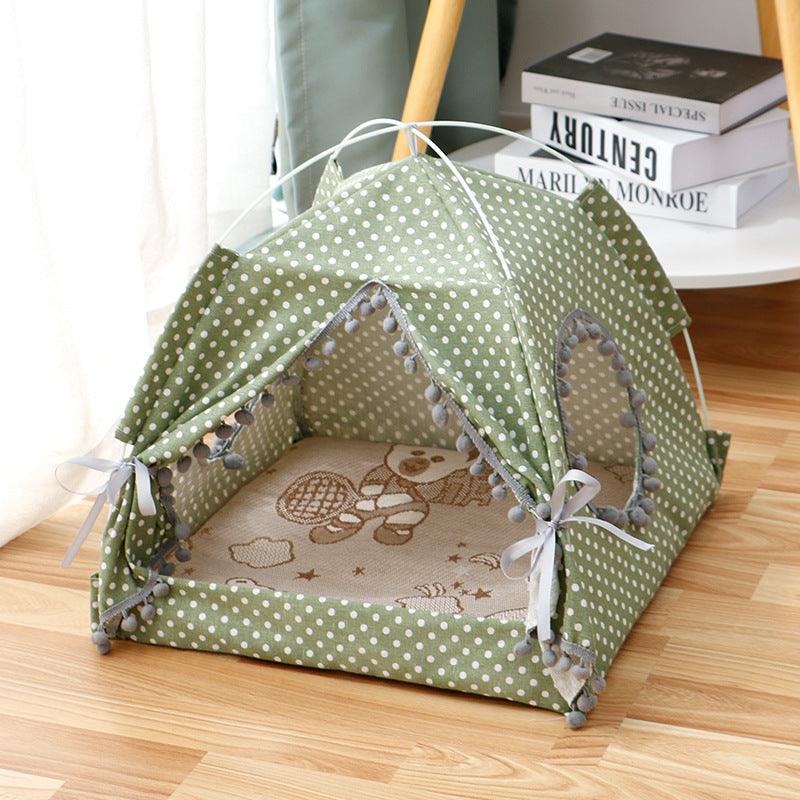 Enclosed Pet Bed in olive green fabric with white polka dots, tent-style roof, open entrance and printed cushion