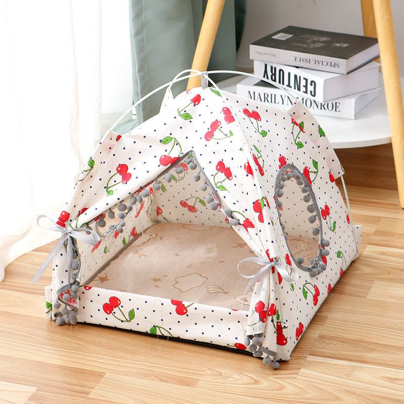 Enclosed Pet Bed in white fabric with red cherry and green leaf print, featuring a tent-like canopy and mesh windows