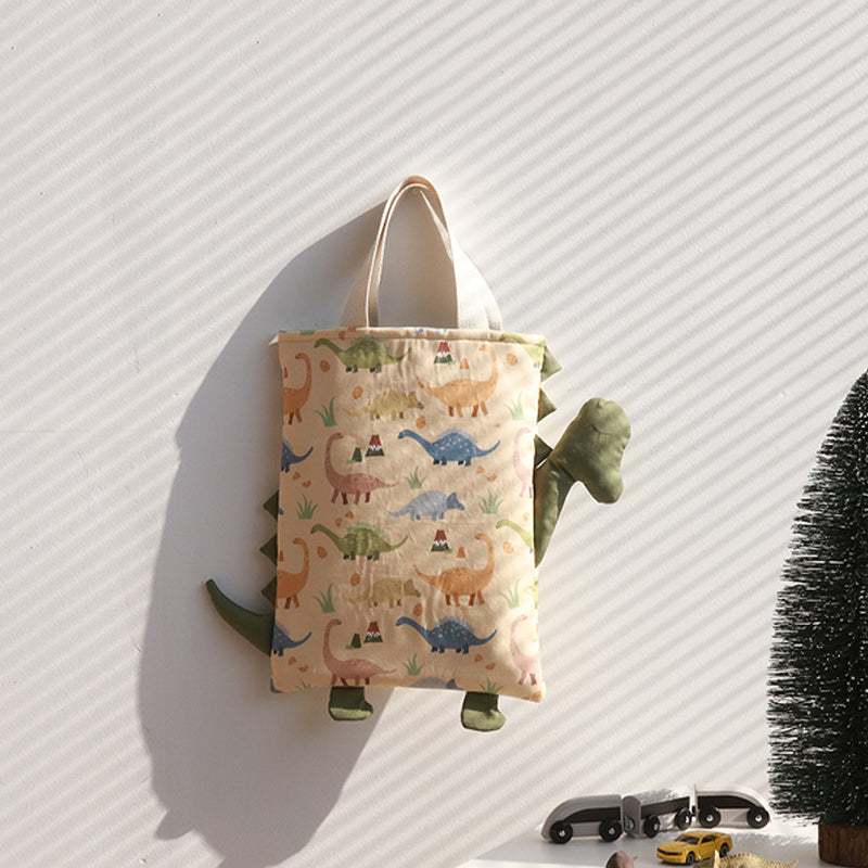 Handmade Printed Fabric tote bag in pale beige cotton with colorful cartoon dinosaur print and green dinosaur-shaped sides