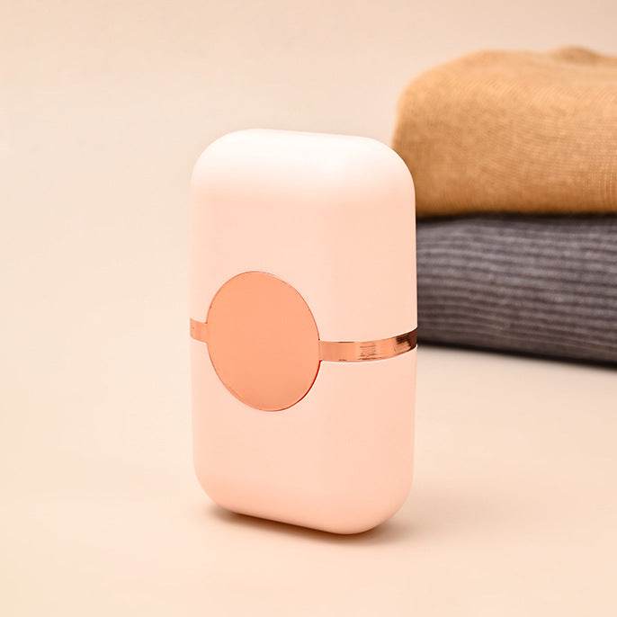 Pet Hair Double Headed lint roller in pale pink ABS plastic with a rounded rectangular case and circular front detail
