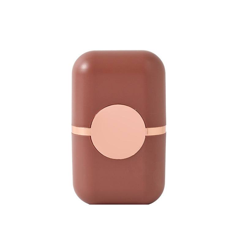 Pet Hair Double Headed lint roller in reddish brown ABS plastic with a pale peach circular center and matching trim
