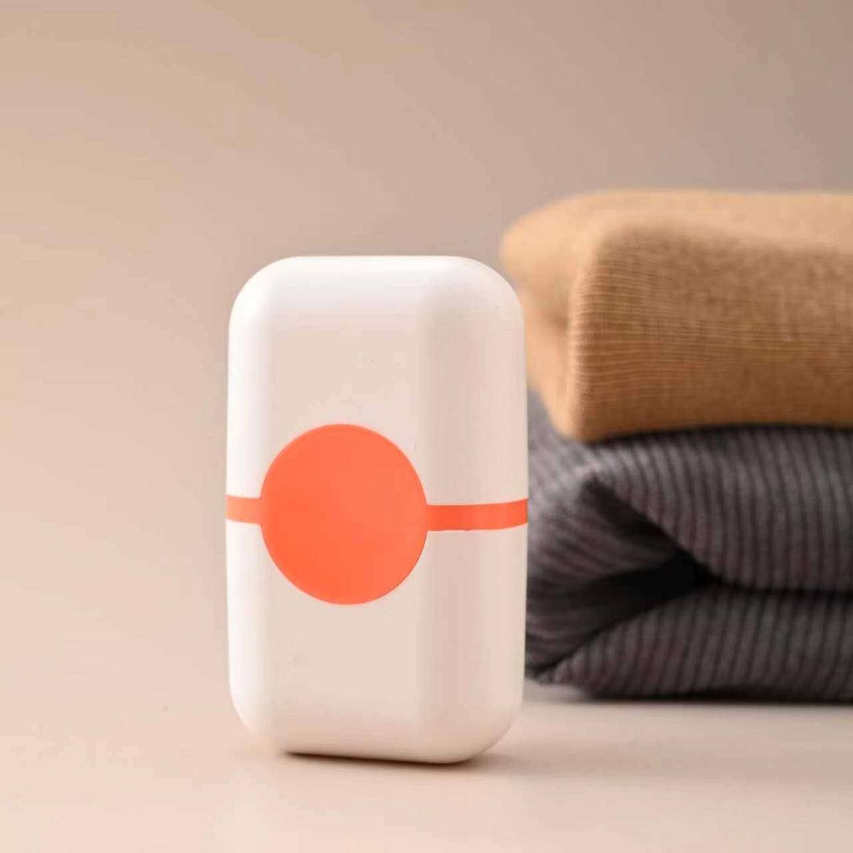 Pet Hair Double Headed lint roller with a white rounded ABS body and bright coral-orange circular detail and band