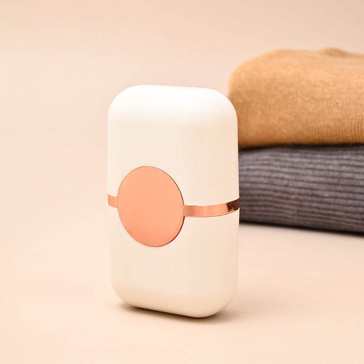 Pet Hair Double Headed lint roller in white ABS with peach-pink accents, compact rounded case and circular front detail
