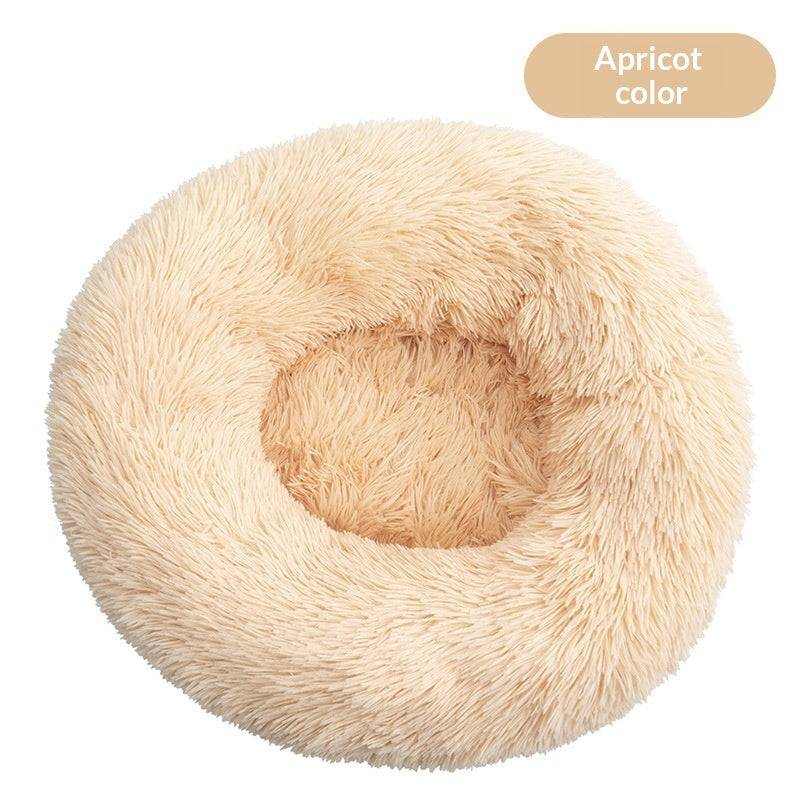 Removable And Washable Dog Bed in apricot plush, featuring a round shaggy surface and a deep cushioned center.