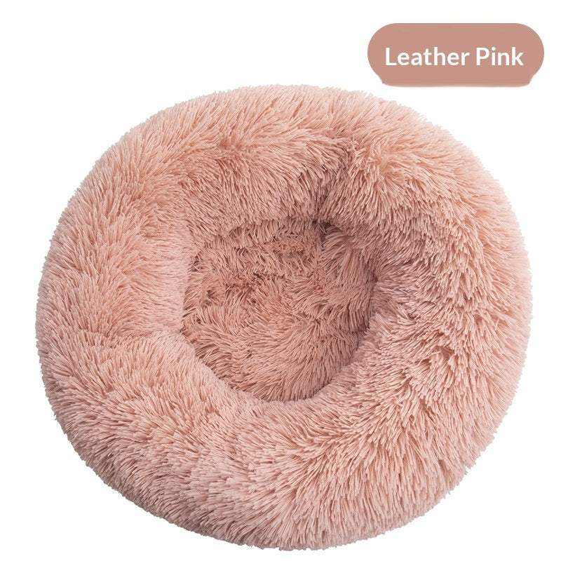 Removable And Washable Dog Bed in dusty pink plush, with a round shape, raised cushioned rim and sunken center
