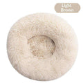 Removable And Washable Dog Bed in light brown plush, with a round, shaggy surface and raised cushioned rim