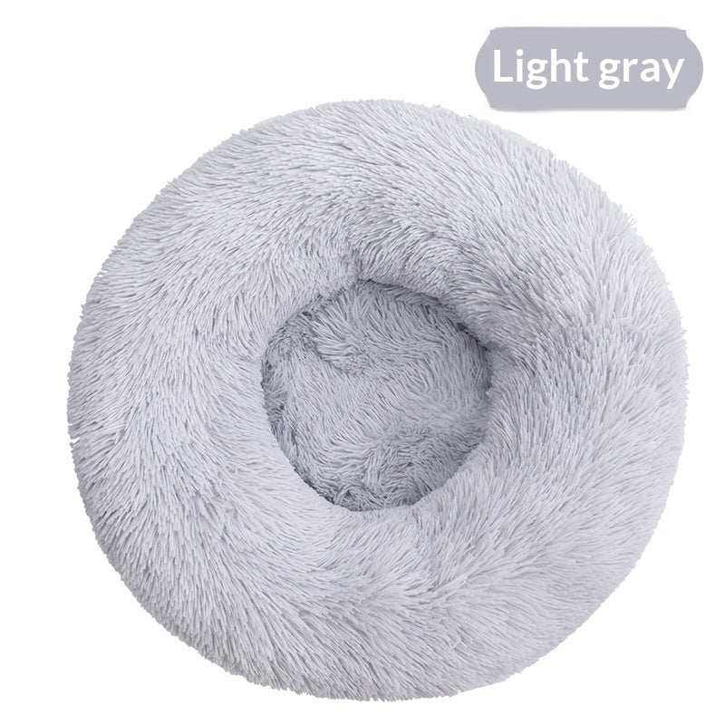 Removable And Washable Dog Bed in light gray plush, with a round shape and deep cushioned center surrounded by raised sides