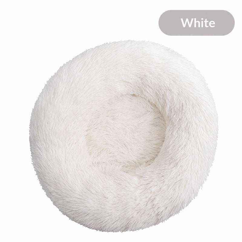 Removable And Washable Dog Bed in white plush with a round donut shape, raised fluffy rim and cushioned center