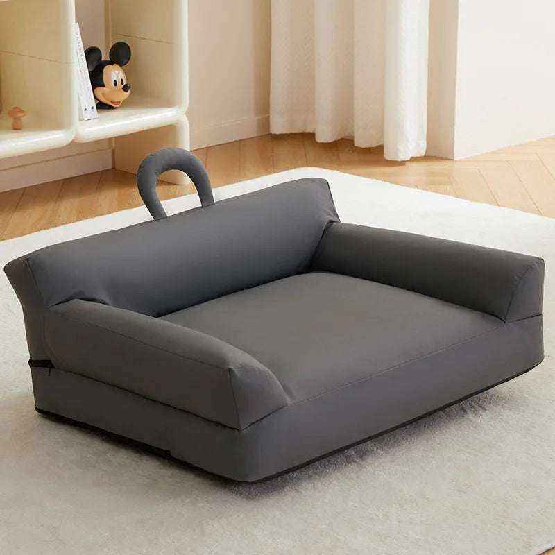 Removable & Washable Pet Bed in solid dark gray fabric, with raised cushioned sides, a broad seat and carry handle