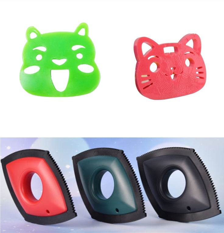 Reusable Pet Hair Remover set with bright green and red animal-face tools and red, teal, and black rubber scrapers