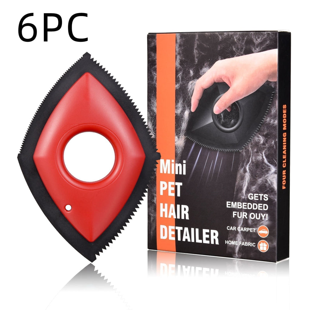 Reusable Pet Hair Remover with a red diamond-shaped handle, black serrated edges, and a central grip hole
